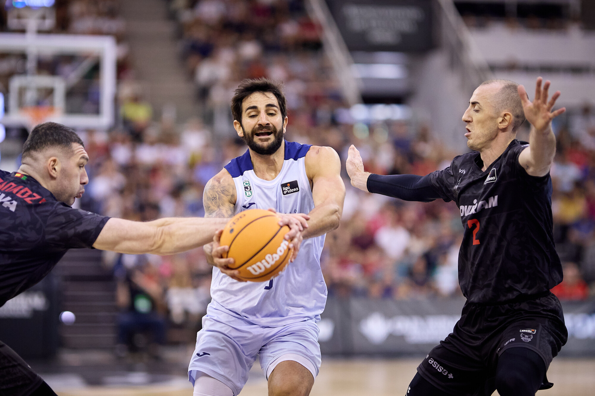 Ricky Rubio drives past Jonathan Rousselle